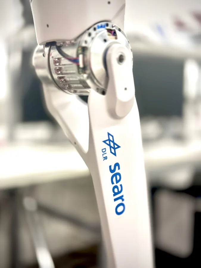 Close-up of a joint of the SEARO arm with the DLR and searo logos